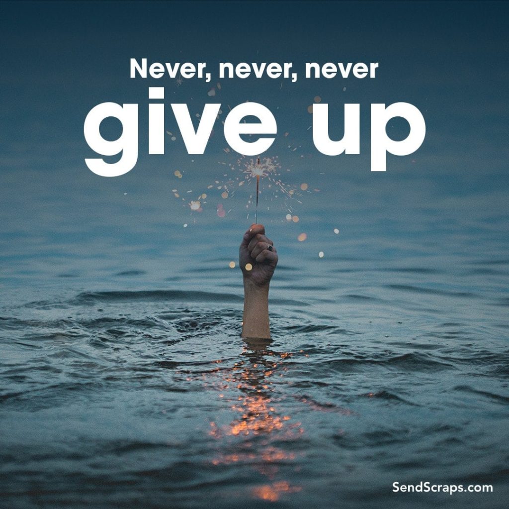 Sparkler held above water with the words: never, never, never give up
